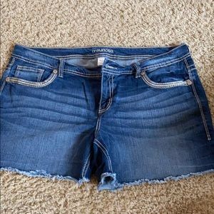 Distressed denim shorts
